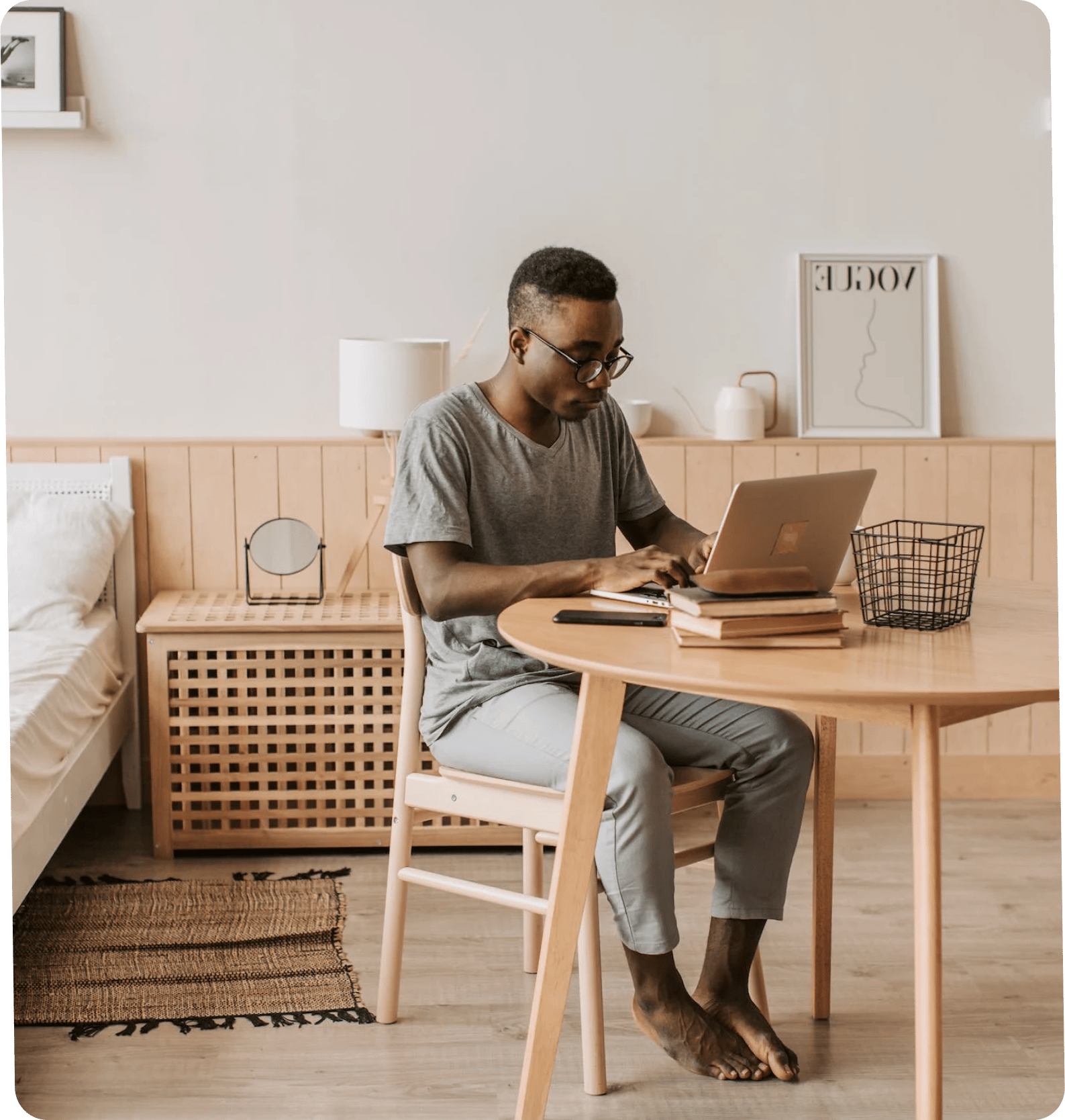 Student working on a laptop in a calm, modern workspace.